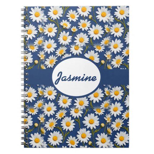 white english daisies on blue notebook