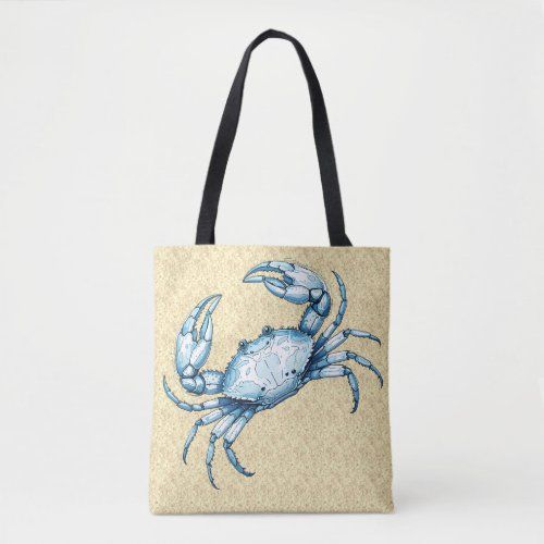 a blue crab on a sandy background tote bag